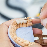 dentist creating denture teeth