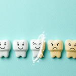 A row of animated teeth that are happily being whitened